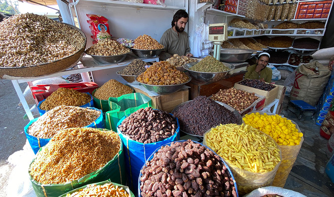 In this file photo, taken on October 2, 2023, a vendor selling dry fruits and nuts waits for customers at his shop in Peshawar. (AN Photo/File)