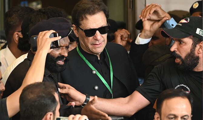 Pakistan’s former Prime Minister Imran Khan (C) leaves after appearing in the Supreme Court in Islamabad on July 24, 2023. (AFP/File)