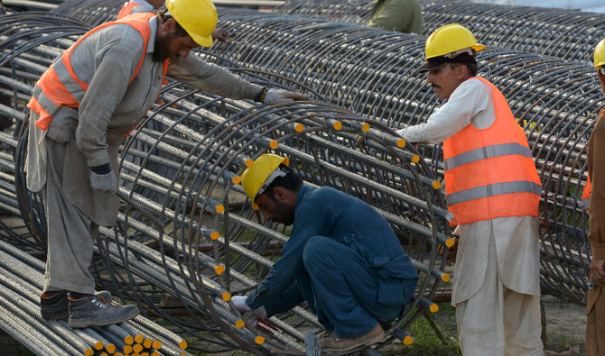 Pakistani laborer work at a construction site in Peshawar on April 30, 2018. (AFP/File)
