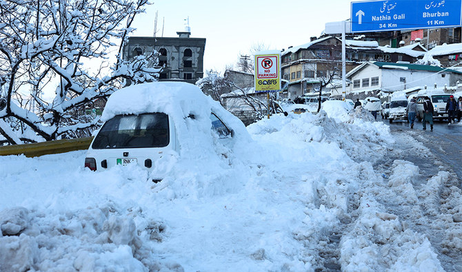 A vehicle is pictured after getting stuck in snow along a road after a heavy snowfall in Murree, around 70 kilometers (45 miles) northeast of the capital, Islamabad on January 8, 2022. (AFP/File)