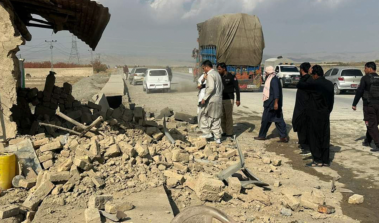 In this file photo, taken on November 30, 2024, security officials inspect police post targeted in an explosion in Qilla Abdullah, Balochistan. (Photo courtesy: X/@NUQTA31/File)