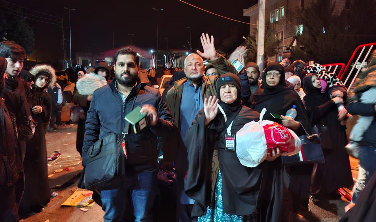 This handout photograph, released by Pakistan’s foreign ministry on December 10, 2024, shows Pakistani nationals crossing the Syria-Lebanon border amid the country’s repatriation of expats after Syria’s opposition forces seized the capital of Damascus last week. (Photo courtesy: MOFA)