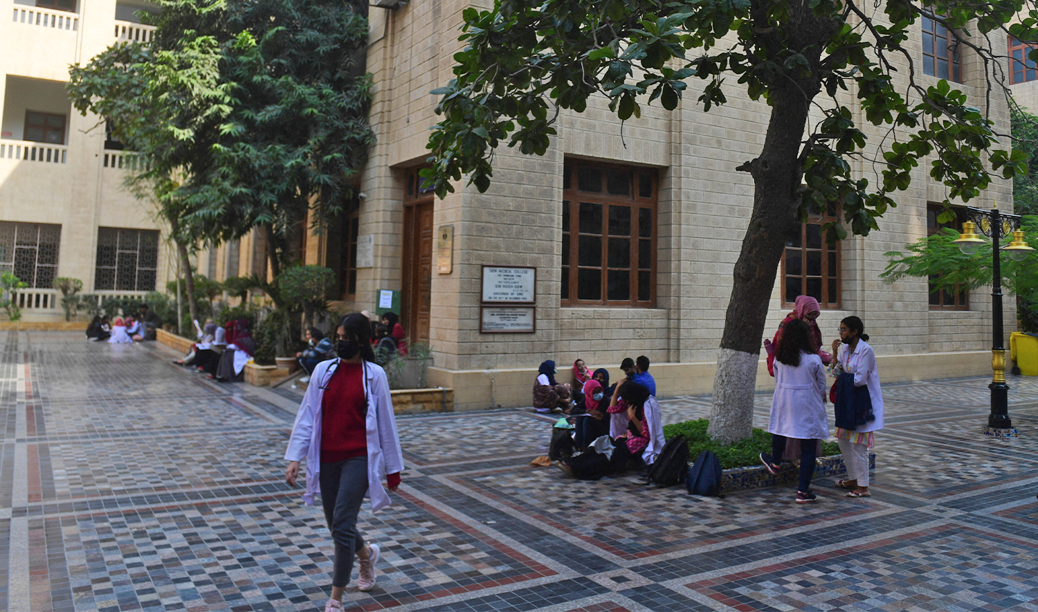 In this picture taken on January 13, 2022, students gather at a yard of the Dow University of Health Sciences in Karachi, Pakistan. (AFP/File)