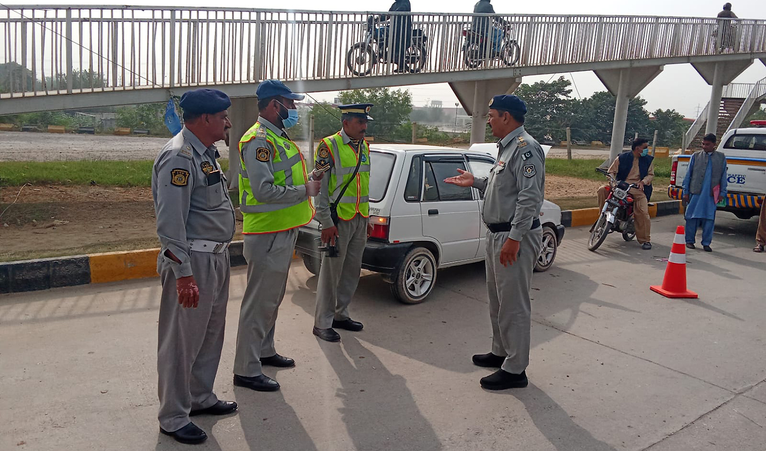Islamabad traffic policemen stand on the roadside in Islamabad, Pakistan, on November 13, 2024. (Islamabad Traffic Police/File)