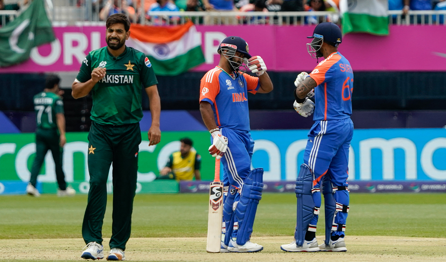 (L-R) Pakistan's Haris Rauf looks on as India's Rishabh Pant talks with teammate Suryakumar Yadav after Pant hit four during the ICC men's Twenty20 World Cup 2024 group A cricket match between India and Pakistan at Nassau County International Cricket Stadium in East Meadow, New York on June 9, 2024. (AFP/File)
