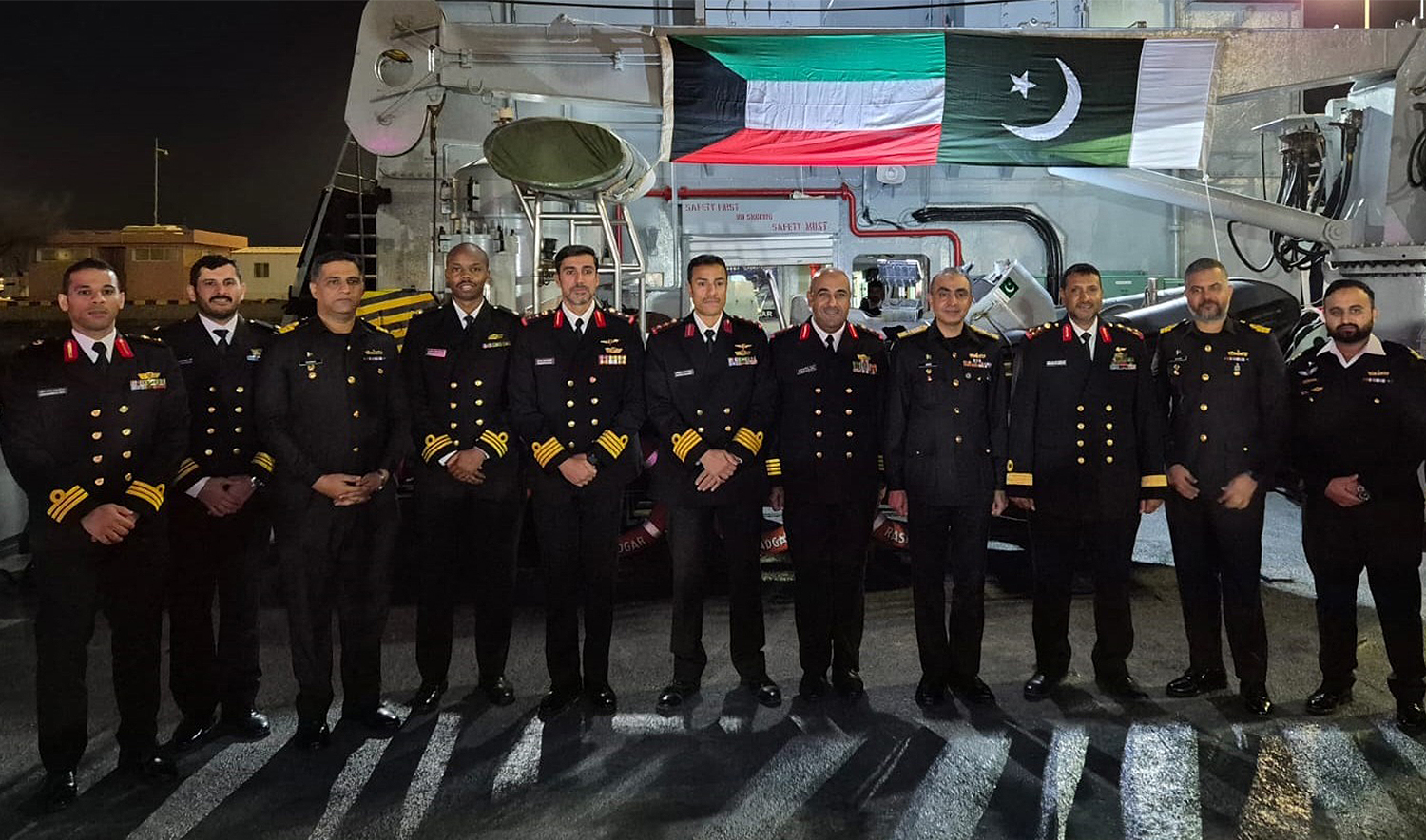Navy officers of Pakistan and Kuwait pose for a group picture onboard Pakistan Navy Ship (PNS) Rasadgar during the Pakistan Navy flotilla to Kuwait on December 20, 2024. (@dgprPaknavy/X)