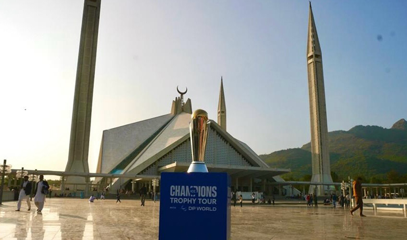 This handout photo, taken and released by the Pakistan Cricket Board on November 18, 2024, shows ICC Champions Trophy 2025 during the trophy tour at the iconic Faisal Mosque in Islamabad. (Photo courtesy: PCB/File)
