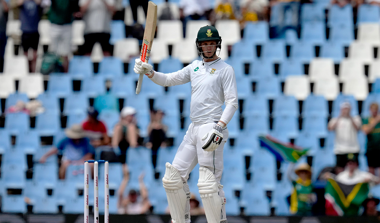 South Africa’s Corbin Bosch raises his bat after scoring half century during day two of the Test cricket match between South Africa and Pakistan, at the Centurion Park in Centurion, South Africa, on December 27, 2024 (AP)
