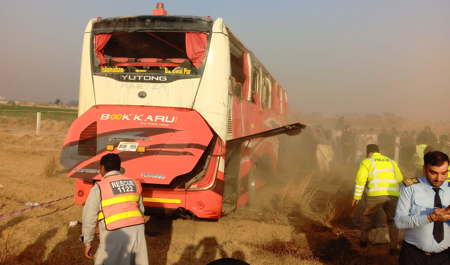 Rescue and police personnel work on the site of a bus crash in Fateh Jang, Pakistan, on December 30, 2024. (National Highway Authority)