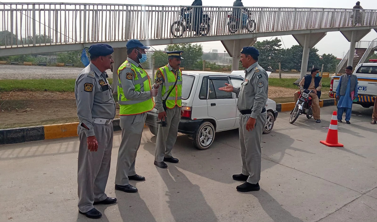 Islamabad traffic policemen stand on the roadside in Islamabad, Pakistan, on November 13, 2024. (Islamabad Traffic Police/File)