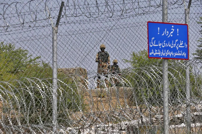 Pakistani troops patrol a fence along the Pak-Afghan border near Torkham in Khyber district on August 3, 2021. (AN Photo/File)