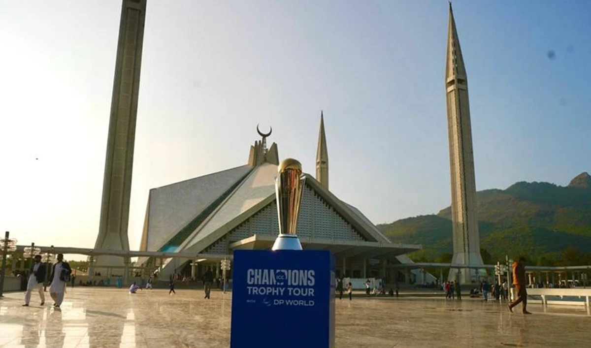 This handout photo, taken and released by the Pakistan Cricket Board on November 18, 2024, shows ICC Champions Trophy 2025 during the trophy tour at the iconic Faisal Mosque in Islamabad. (Photo courtesy: PCB/File)