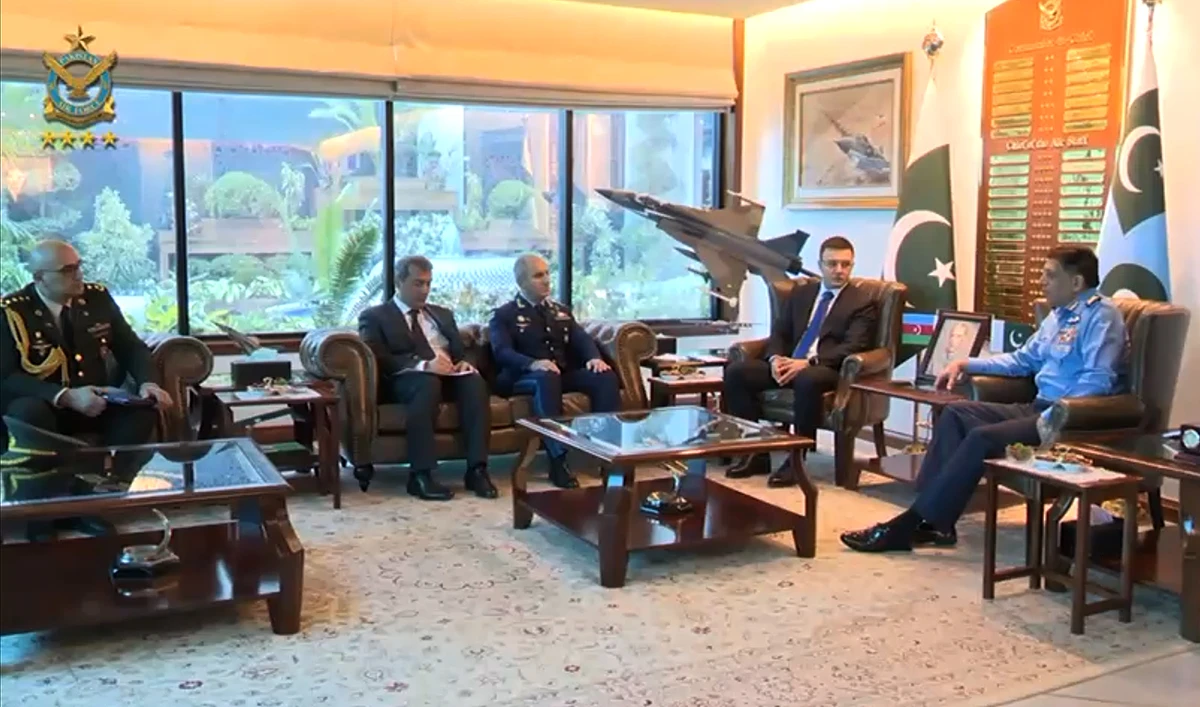 In this handout photograph, taken and released by Pakistan Air Force, a high-level Azerbaijani delegation, comprising Deputy Defense Minister Agil Gurbanov (2R), gestures during a meeting with Pakistan Air Chief Marshal Zaheer Ahmed Baber Sidhu (R) at the Air Headquarters in Islamabad on December 23, 2024.