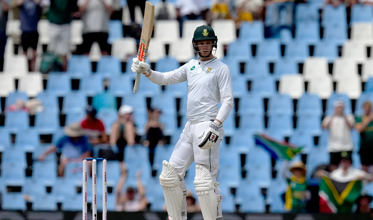 South Africa’s Corbin Bosch raises his bat after scoring half century during day two of the Test cricket match between South Africa and Pakistan, at the Centurion Park in Centurion, South Africa, on December 27, 2024 (AP)