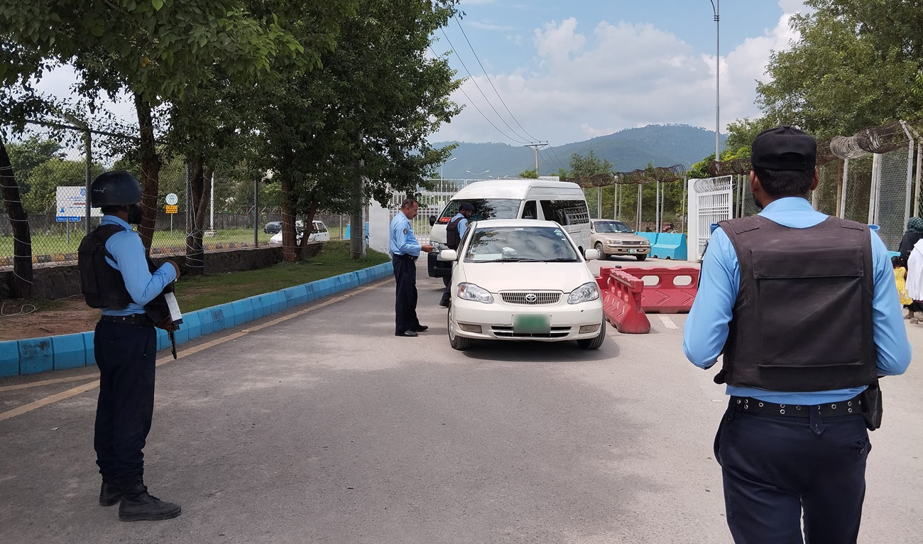 In this file photograph, taken and released by the Islamabad Police on September 3, 2024, security officials check vehicles entering the Red Zone of Pakistan’s federal capital. (Photo courtesy: IP/File)