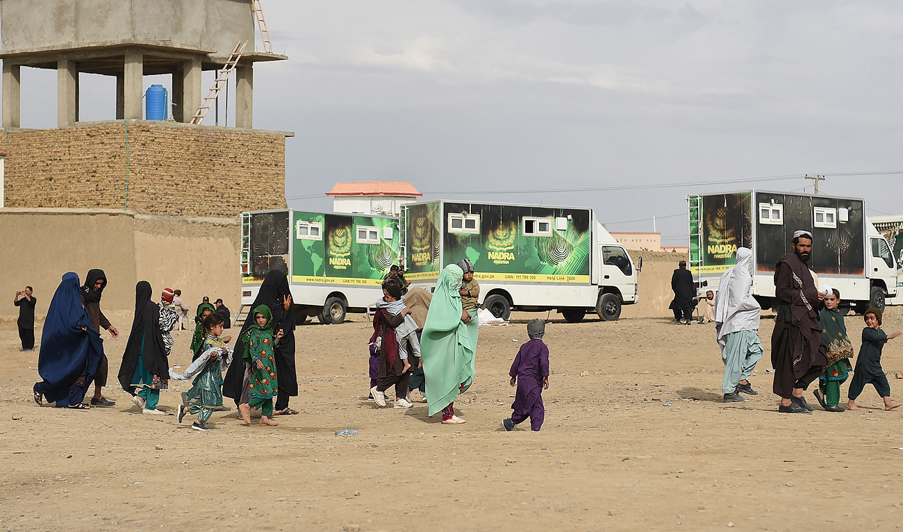 In this file photo, taken on November 7, 2023, Afghan refugees walk near the Pakistan-Afghanistan border in Chaman. (AFP/File)