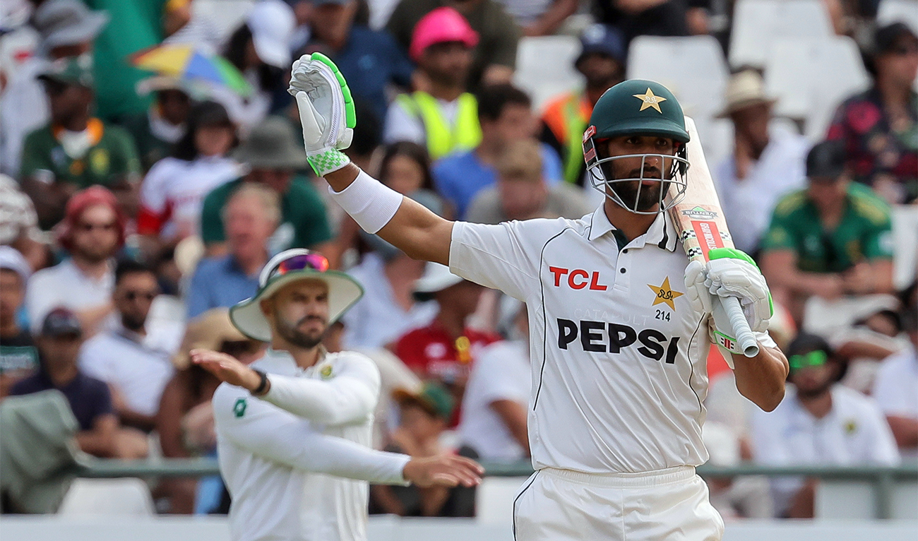 Pakistan’s Shan Masood (foreground) gestures during the third day of the second test cricket match between South Africa and Pakistan, in Cape Town, South Africa, on January 5, 2025. (AP)
