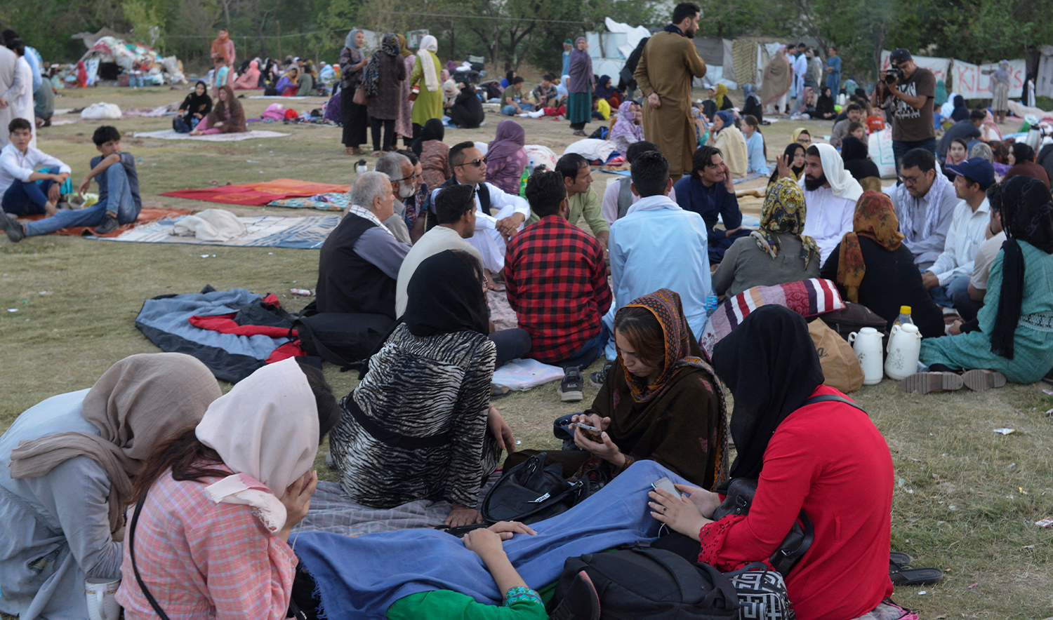 Afghan refugees seeking asylum abroad gather at an open field in protest to demand help from the United Nations High Commissioner for Refugees (UNHCR), in Islamabad on May 7, 2022. (AFP/File)