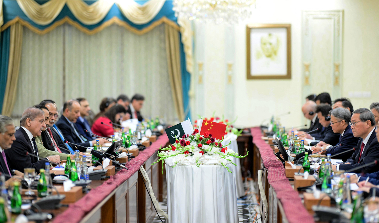 In this file photograph taken on October 14, 2024, and released by Pakistan’s Prime Minister Office, China’s Premier Li Qiang (2R) and Pakistan’s Prime Minister Shehbaz Sharif (2L) attend their delegation level talks at the Prime Minister House in Islamabad. (Photo courtesy: PMO)