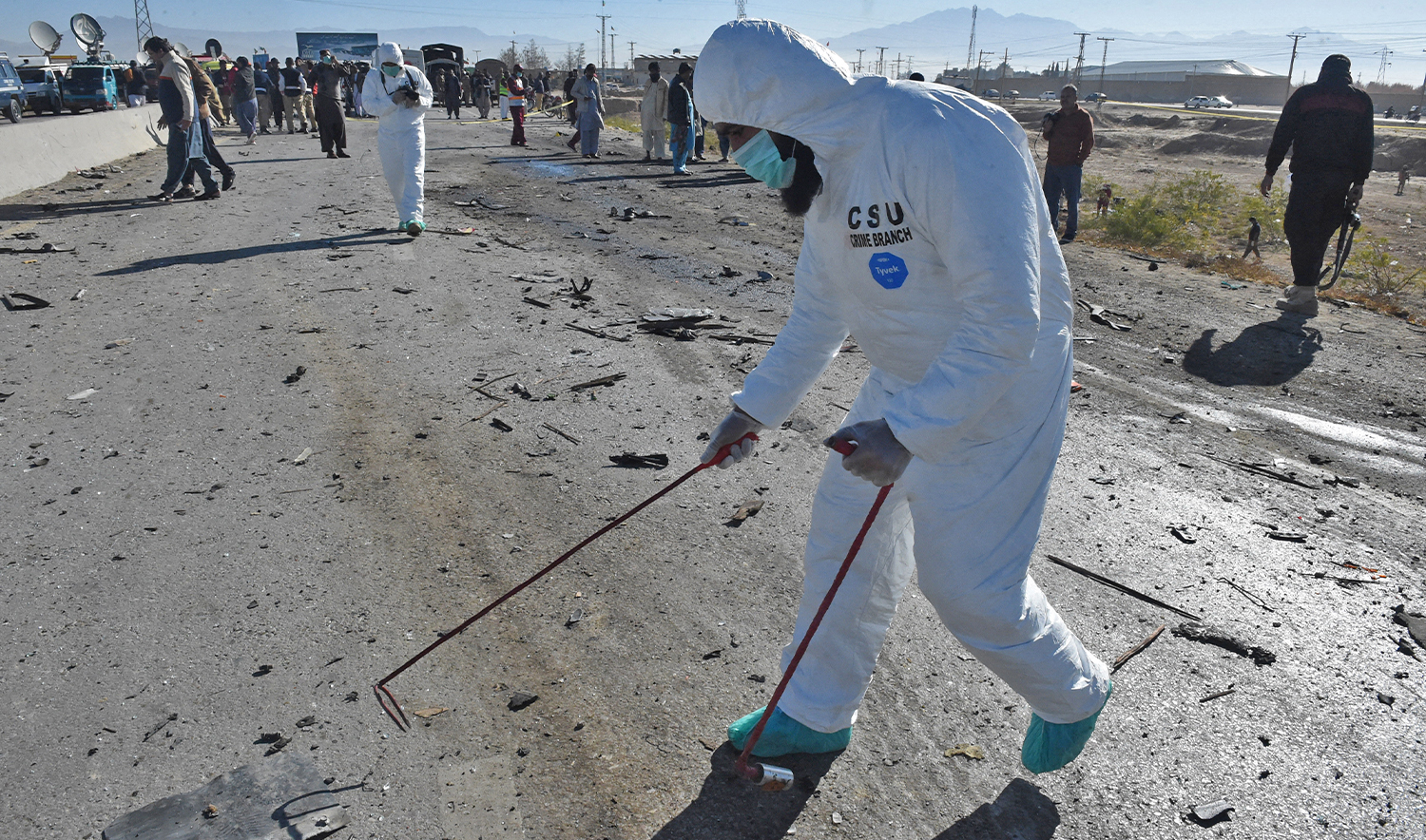 Security officials inspect the site of a suicide bomb attack targeting a police truck in Quetta on November 30, 2022. (AFP/File)