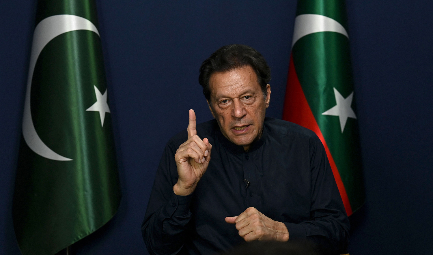 Pakistan's former prime minister Imran Khan gestures as he speaks during an interview with AFP at his residence in Lahore on May 18, 2023. (AFP/File)