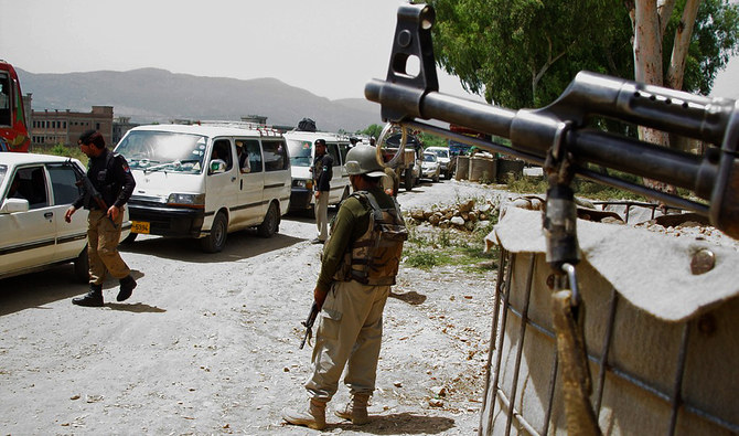 In this file picture, taken on June 17, 2014, Pakistani security personnel keep watch at a checkpoint in Hangu, a town in the Khyber Pakhtunkhwa province. (AFP/File)