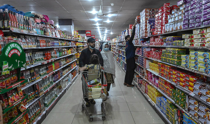 People buy grocery items at a store in Peshawar, Pakistan, on March 20, 2023. (Photo courtesy: AFP/File)