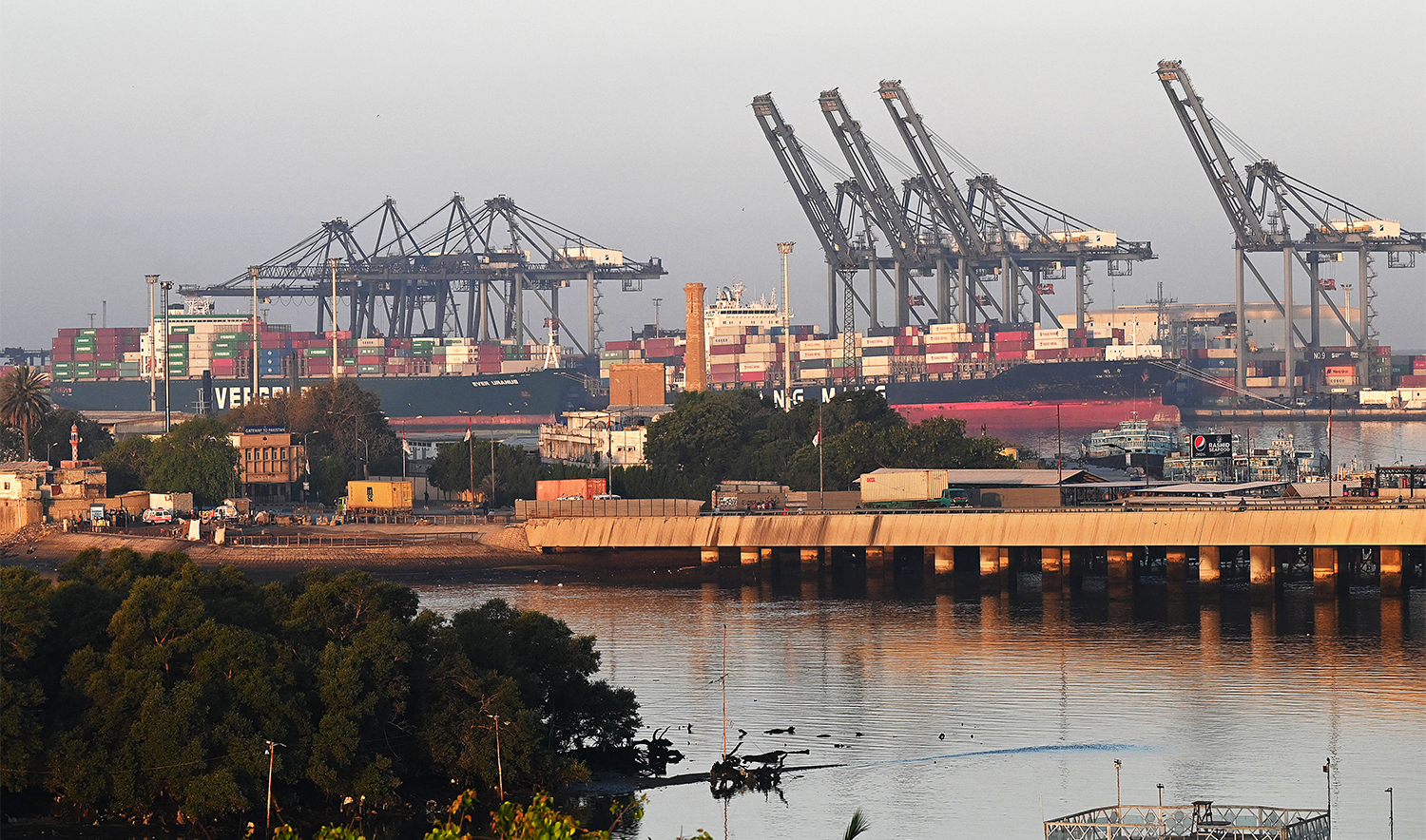 Shipping containers are seen stacked on a ship at a sea port in Karachi on April 6, 2023. (AFP/ file)
