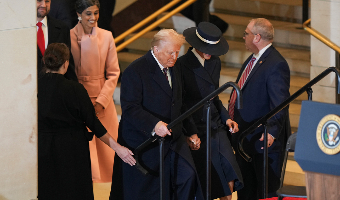 President Donald Trump, left, and First Lady Melania Trump arrive at Emancipation Hall after the 60th Presidential Inauguration in the US Capitol in Washington on January 20, 2025. (AP)