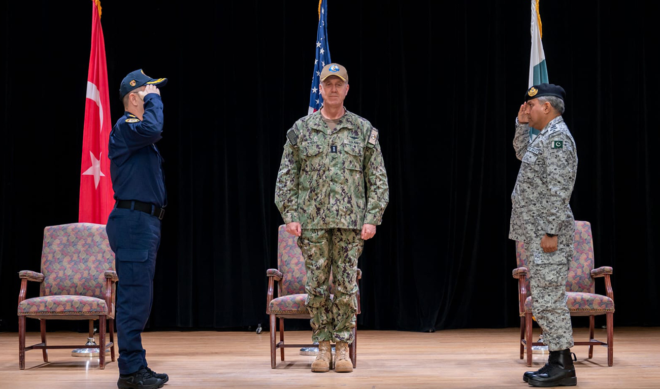 In this handout photo, taken and released by Pakistan Navy on January 23, 2025, Commodore Sohail Ahmed Uzmi (right) of Pakistan Navy salutes as he assumes Commander of Combined Task Force-151 during the Change of Command Ceremony in Bahrain. (Photo courtesy: Pakistan Navy)