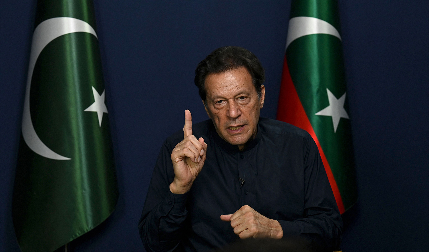 Pakistan's former prime minister Imran Khan gestures as he speaks during an interview with AFP at his residence in Lahore on May 18, 2023. (AFP/File)