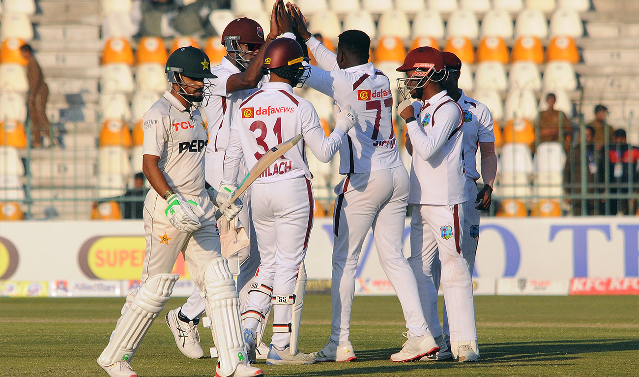 Kevin Sinclair (third right) celebrates with teammates after taking the wicket of Pakistan’s Babar Azam (left) during day two of the second cricket test match in Multan, Pakistan, on January 26, 2025. (PCB)