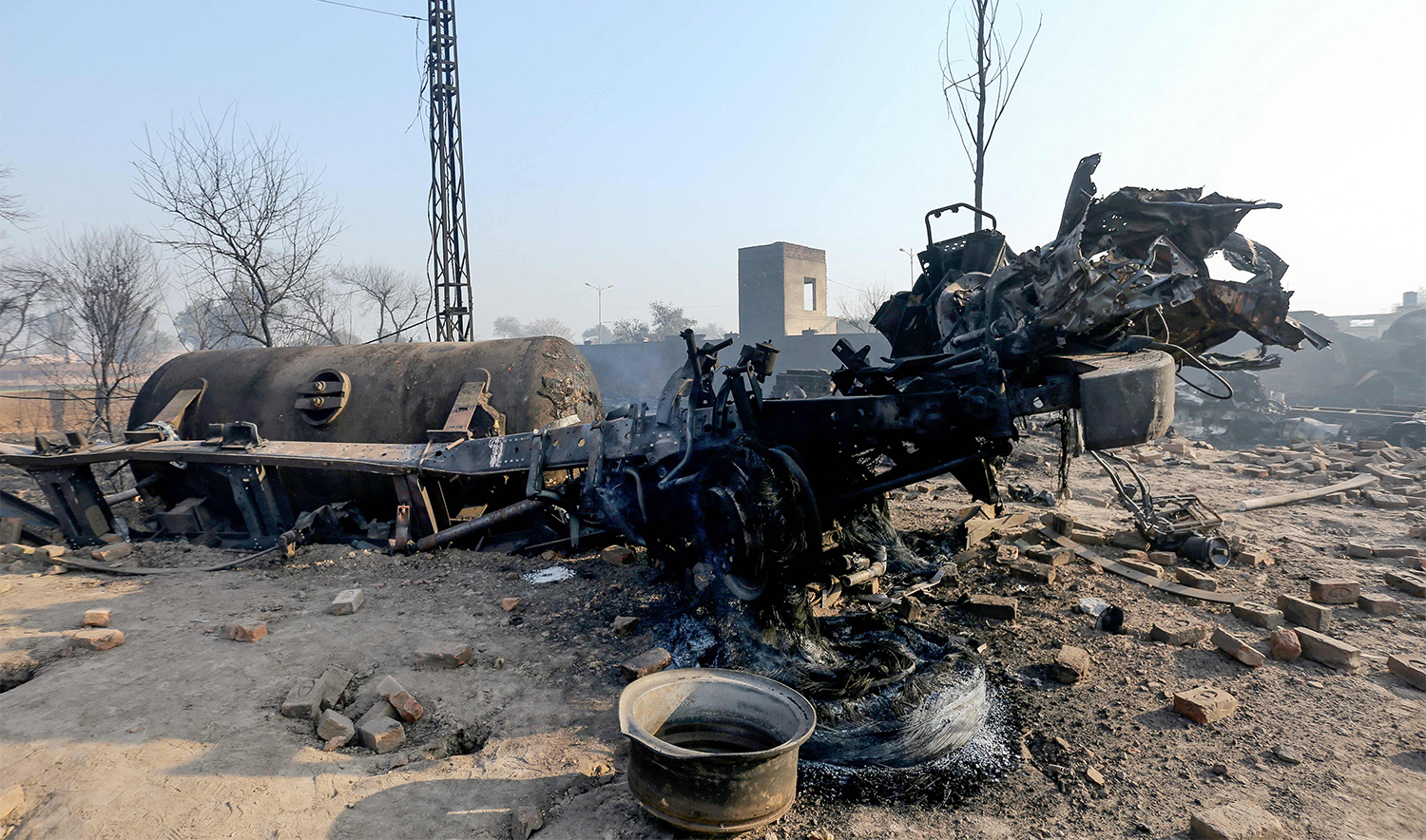 An LPG tanker truck lies charred after it exploded near an industrial area in Multan on January 27, 2025. (AFP)