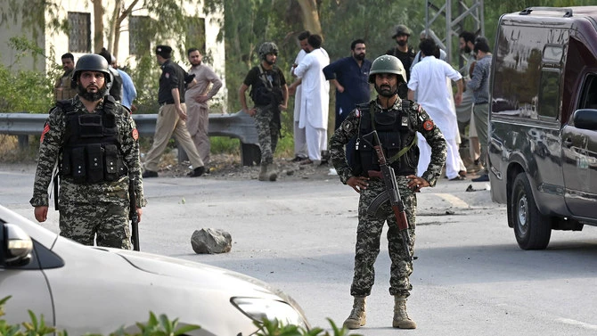 In this file photo, taken on July 18, 2023, Pakistani security personnel stand guard at the Hayatabad area of Peshawar. (AFP/File)