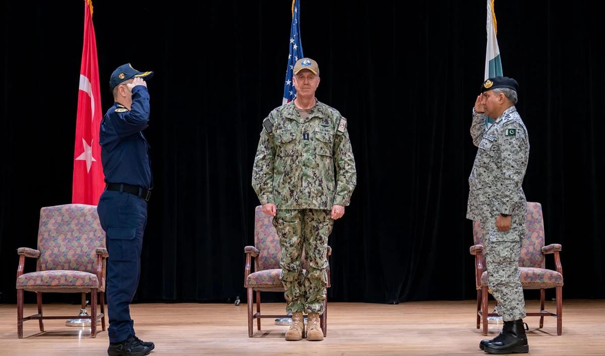 In this handout photo, taken and released by Pakistan Navy on January 23, 2025, Commodore Sohail Ahmed Uzmi (right) of Pakistan Navy salutes as he assumes Commander of Combined Task Force-151 during the Change of Command Ceremony in Bahrain. (Photo courtesy: Pakistan Navy)