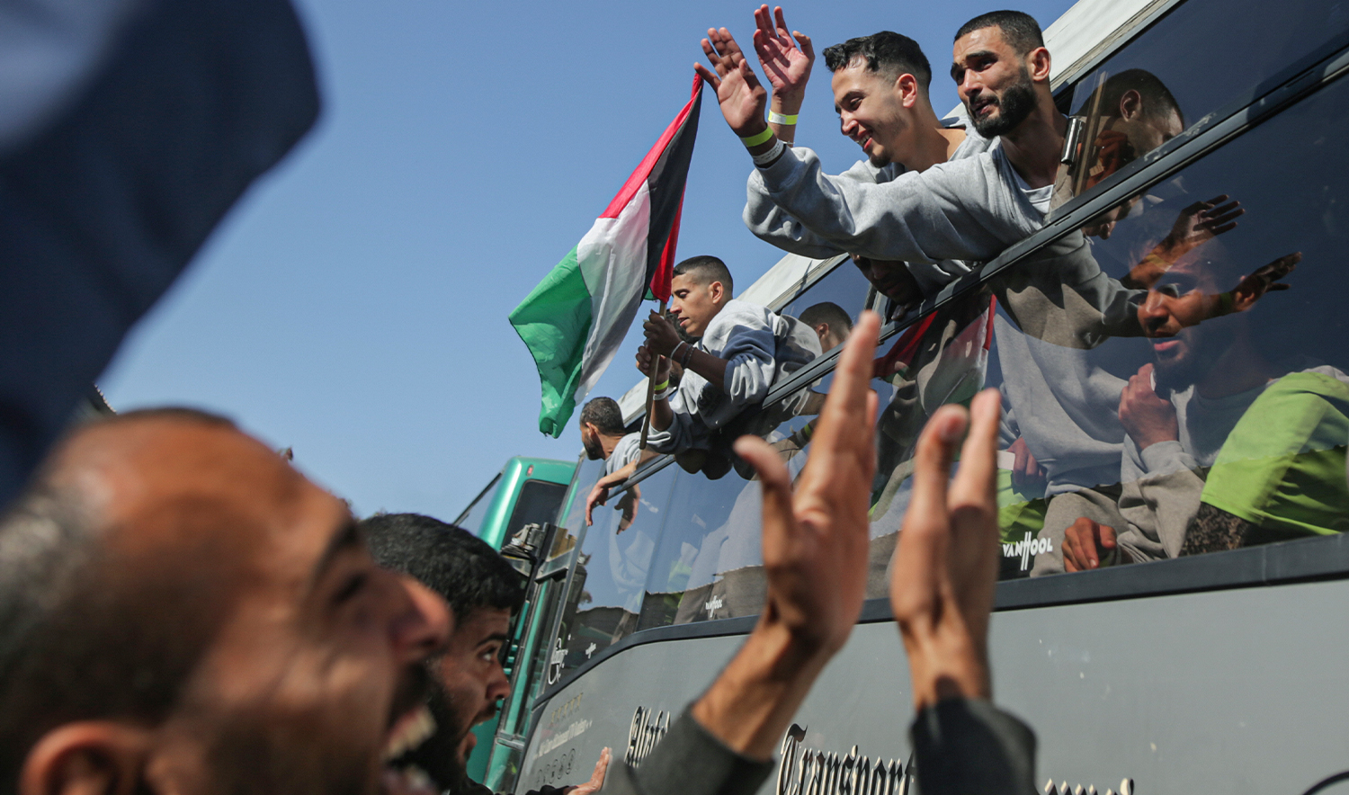 Freed Palestinian prisoners are greeted by a crowd as they arrive in the Gaza Strip after being released from an Israeli prison following a ceasefire agreement between Hamas and Israel in Khan Younis, on February 1, 2025. (AP)