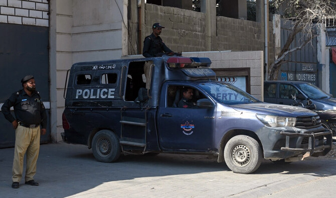 Police officers stand guard outside a factory where, according to police, two Chinese nationals were shot and injured, in Karachi, Pakistan on November 5, 2024. (AFP/File)