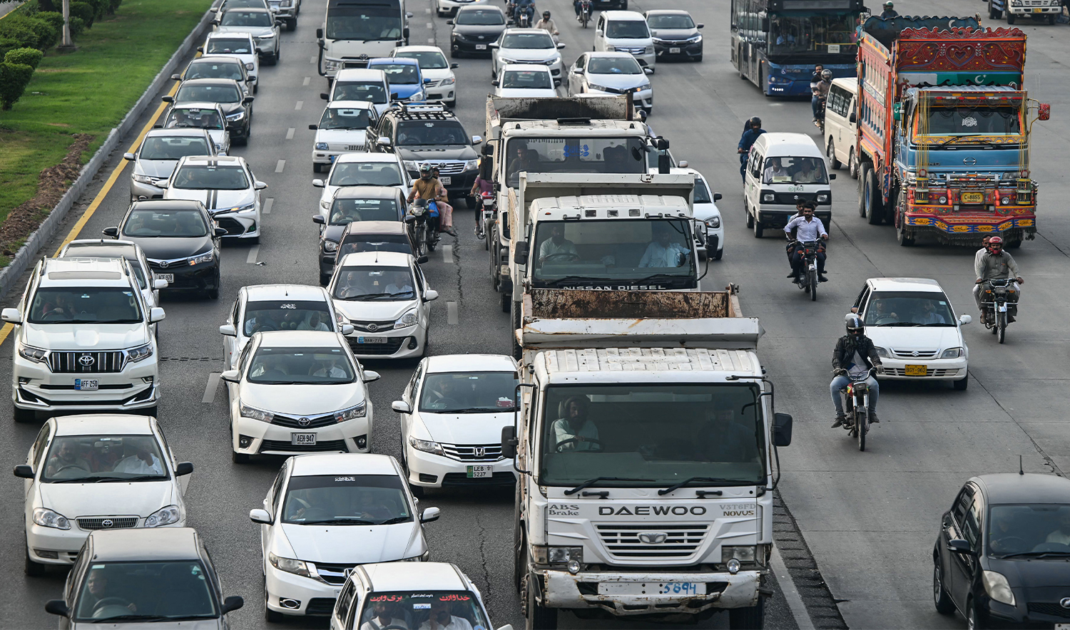 Commuters drive along a highway in Islamabad on September 26, 2024. (AFP/File)