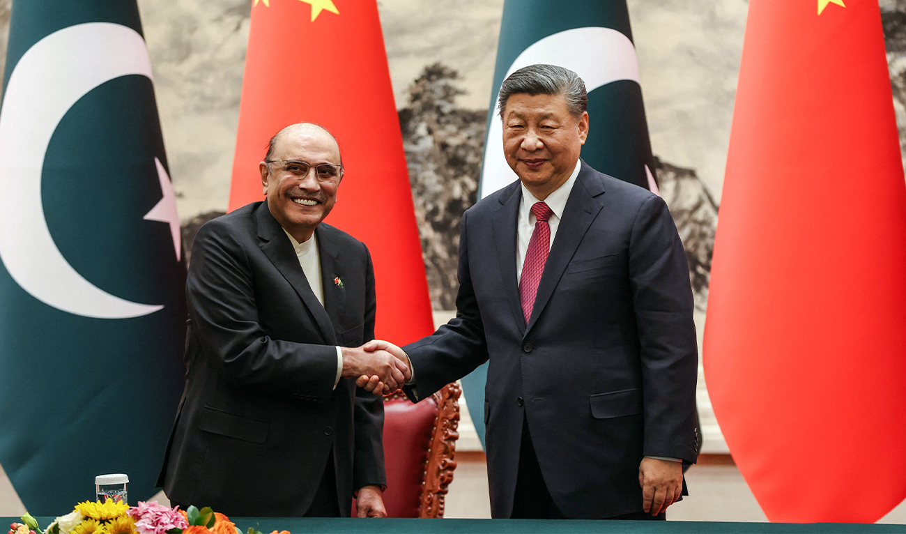 Chinese President Xi Jinping (R) and Pakistani President Asif Ali Zardari shake hands at a signing ceremony in the Great Hall of the People in Beijing on February 5, 2025. (AFP)