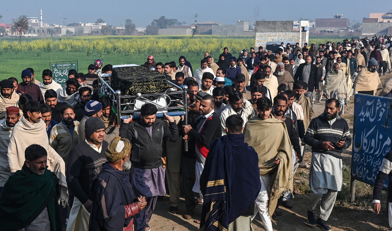Family members and residents carry the coffin of Arslan Khan, a victim of last month’s migrant boat capsizing off North Africa, during his funeral ceremony in Mirza Virkan village, in eastern Punjab province, on February 6, 2025. A Pakistan village on February 6 buried one of its residents among 13 migrants from the country who drowned as their boat capsized off North Africa last month. (AFP)