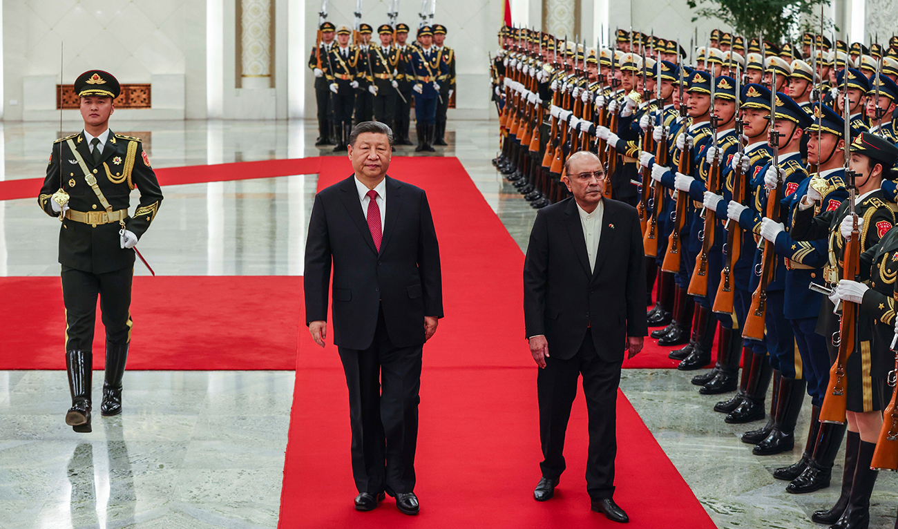 Chinese President Xi Jinping, left, and Pakistani President Asif Ali Zardari walk past honor guards during the welcome ceremony at the Great Hall of the People in Beijing on February 5, 2025. (AP)