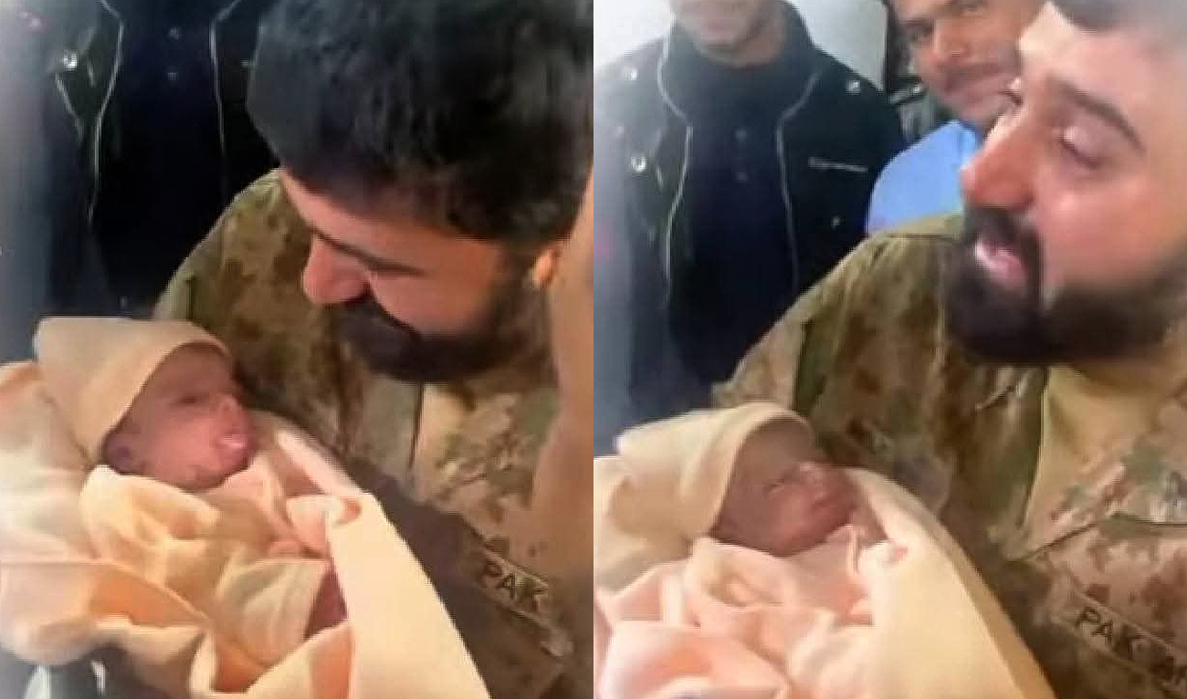 This screengrab, taken from a video released by Radio Pakistan on February 8, 2025, shows Pakistan Army officer carrying a baby rescued after being buried alive in Nowshera, Khyber Pakhtunkhwa. (Radio Pakistan)