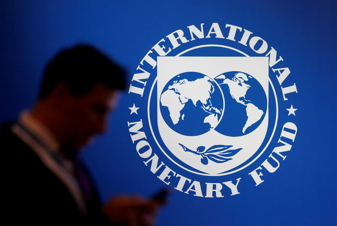 A man stands near a logo of IMF at the International Monetary Fund - World Bank Annual Meeting 2018 in Nusa Dua, Bali, Indonesia, on October 12, 2018. (REUTERS/File)