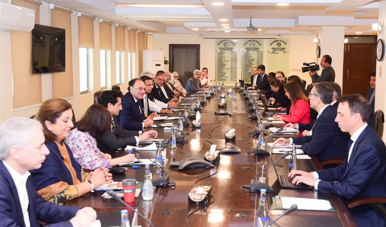 This handout photograph released by the Pakistan Press Information Department (PID) on November 12, 2024, shows Pakistan’s Finance Minister Muhammad Aurangzeb (5L) meeting with a International Monetary Fund (IMF) review mission led by Nathan Porter (3R) at the Finance Ministry in Islamabad on November 11, 2024. (PID/File)
