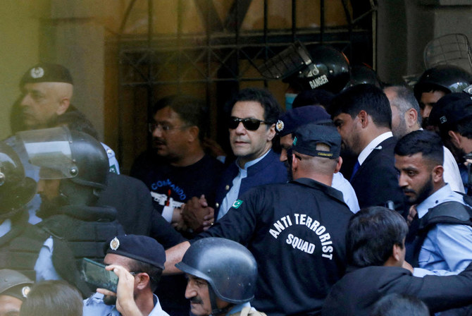 Security officers escort Pakistan’s former Prime Minister Imran Khan outside Islamabad High Court, in Islamabad, Pakistan, on May 12, 2023. (Reuters/File)
