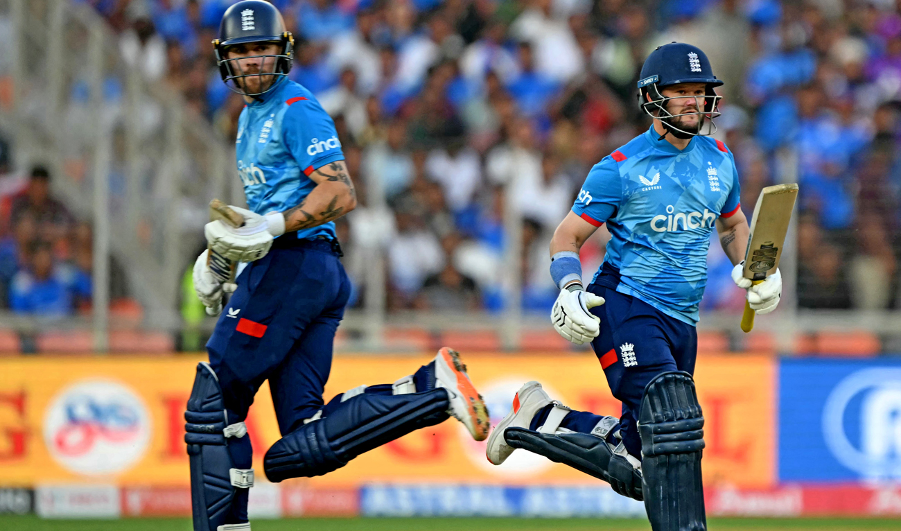 England’s Ben Duckett (R) and Phil Salt run between the wickets during the third one-day international (ODI) cricket match between India and England at the Narendra Modi Stadium in Ahmedabad on February 12, 2025. (AFP)
