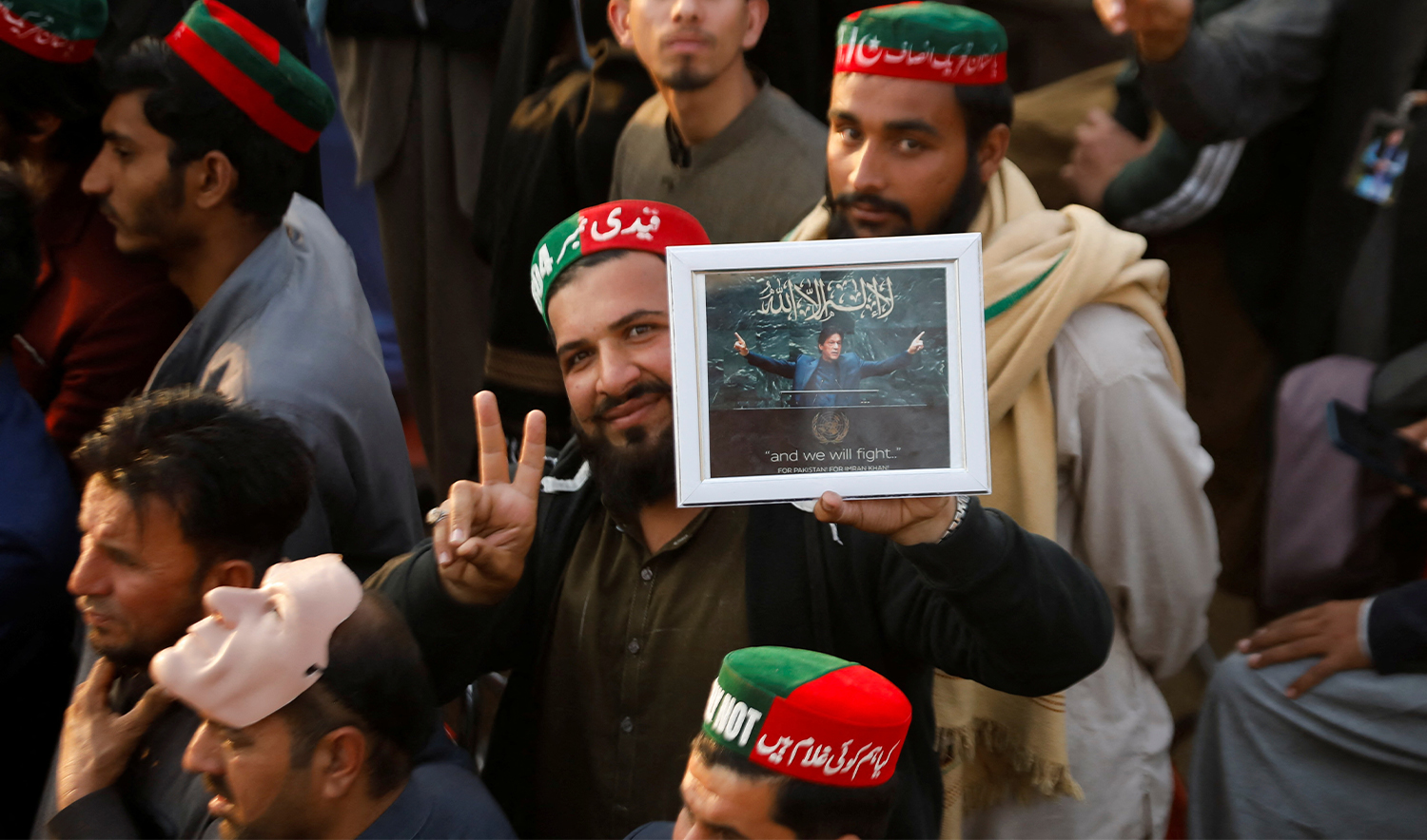 A supporter of the former Pakistani Prime Minister Imran Khan's party, the Pakistan Tehreek-e-Insaf (PTI), poses with his portrait as he, along with others gather, to protest what they call a black day and a stolen mandate in last year's general election, during a rally in Swabi, Pakistan on February 8, 2025. (REUTERS/File)