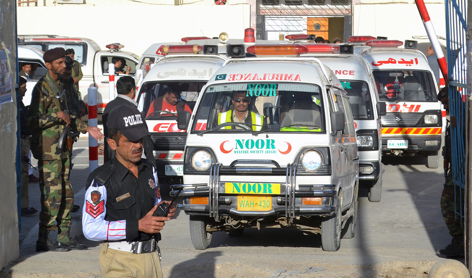 Pakistani security personnel stand guard as an ambulance carrying the coffins of attack victims drives past in Quetta on October 25, 2016. (AFP/File)