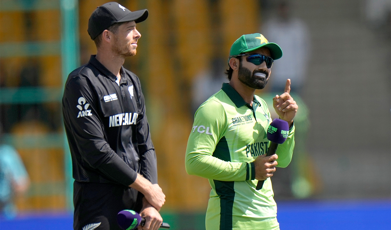 Pakistan's Mohammad Rizwan, right, and New Zealand's Mitchel Santner wait for coin toss before the start the ICC Champions Trophy cricket match between Pakistan and New Zealand, in Karachi, Pakistan, on Feb. 19, 2025. (AP)