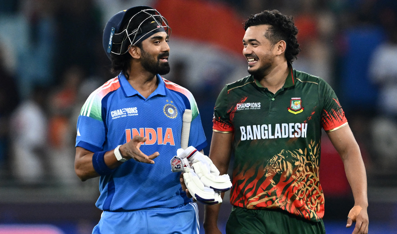 India’s KL Rahul (L) speaks with Bangladesh’s Taskin Ahmed at the end of the ICC Champions Trophy one-day international (ODI) cricket match between Bangladesh and India at the Dubai International Stadium in Dubai on February 20, 2025. (AFP)